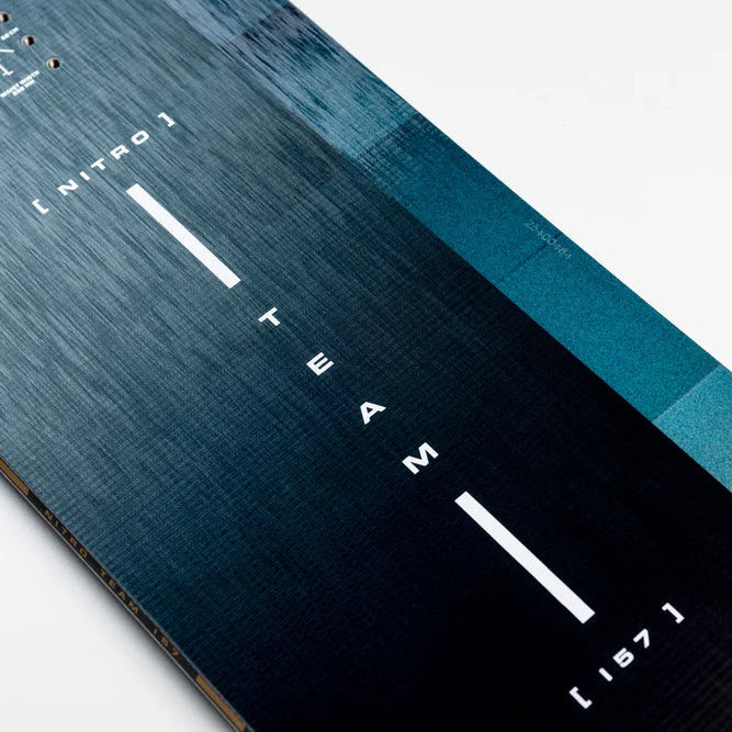 Close-up of a snowboard with branding and text on a white background