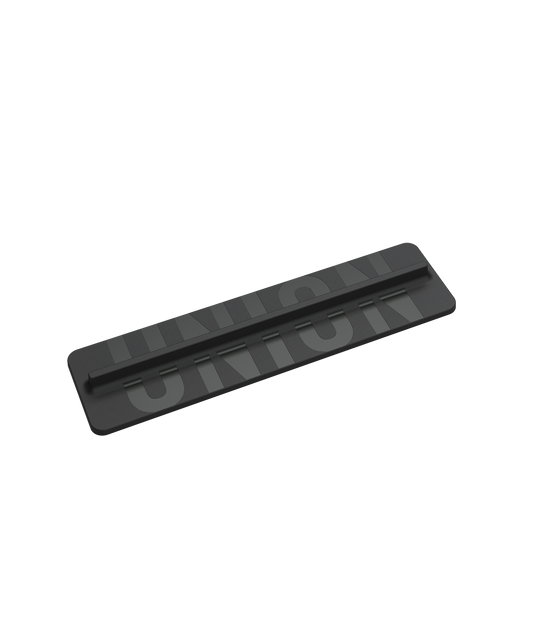 black plastic boot scraper style stomp pad with grey union writing across the length of it.