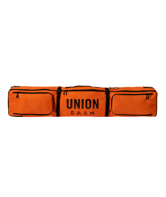 large bright orange wheeled snowboard bag with union logo in the middle, two large pockets either side and two black straps around the body.