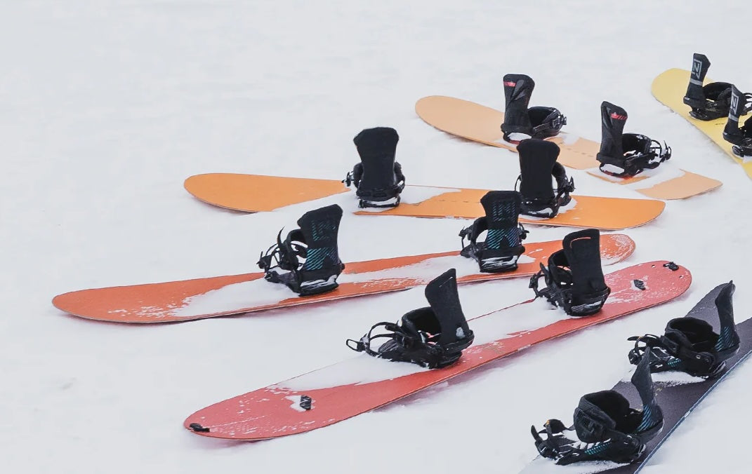 colourful nitro snowboards sat on the snow