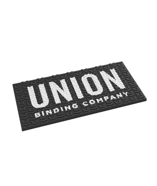 square rubber union stomp pad.black with union writing across the face in white