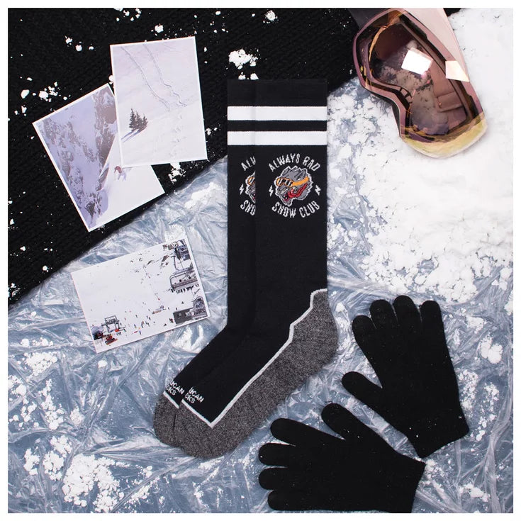 american socks snowboard socks.. black with grey soles, two white bands around the top and a wolf logo that says 'always rad, snow club'