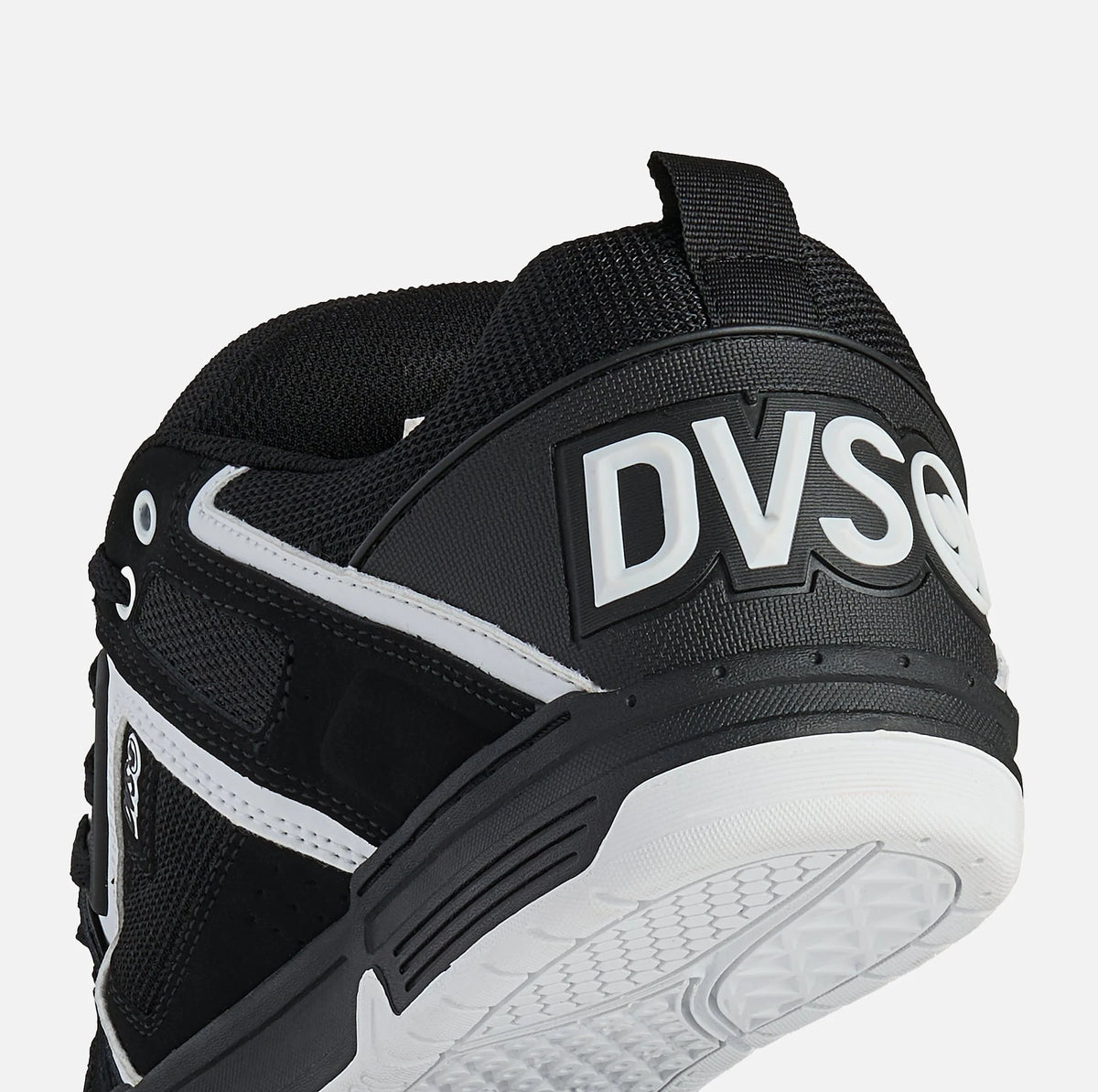 Black and white sneaker with 'DV8' branding on a light gray background