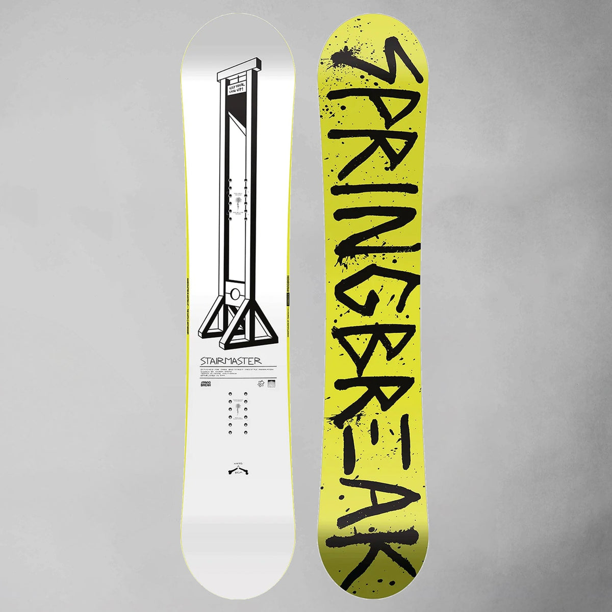 Two views of a snowboard deck on a gray background: one showing a white base with a black graphic and text, and the other showing a bright yellow base with large black 'SPRINGBREAK' lettering.
