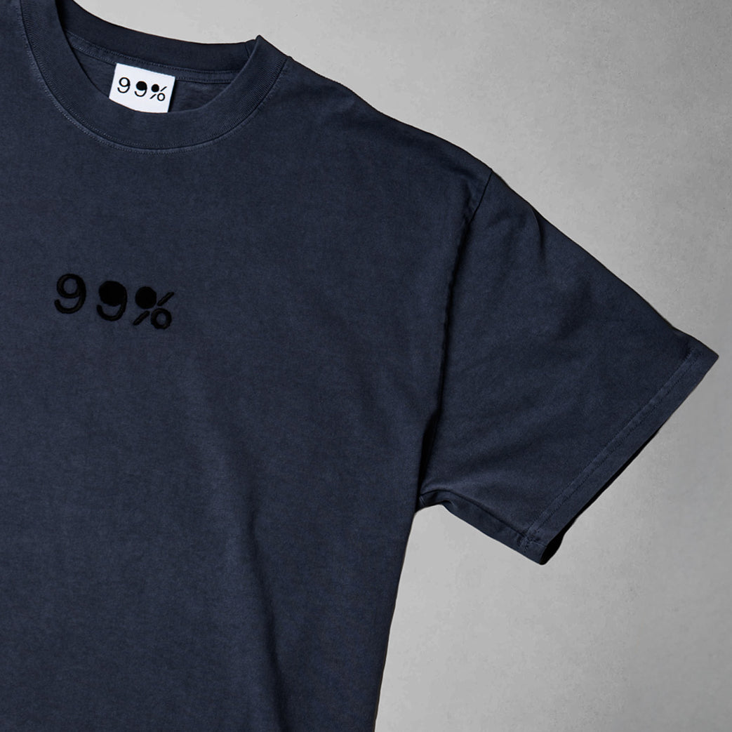 Navy blue t-shirt with '99%' text on a gray background