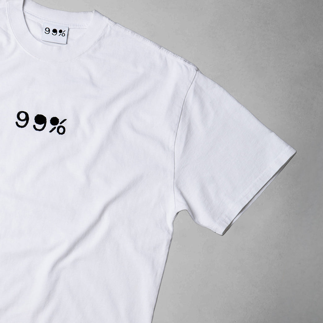 White t-shirt with '99%' print on a gray background