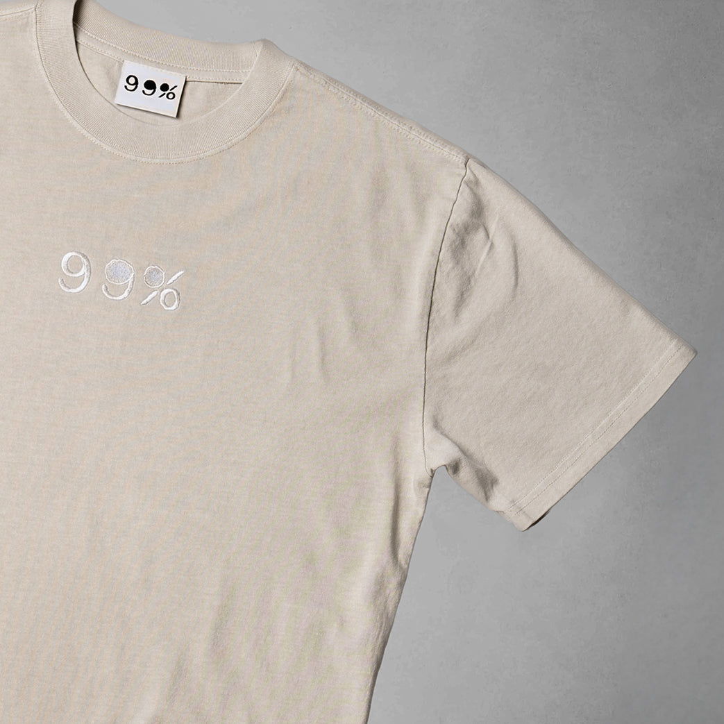 Beige t-shirt with '99%' logo on a gray background
